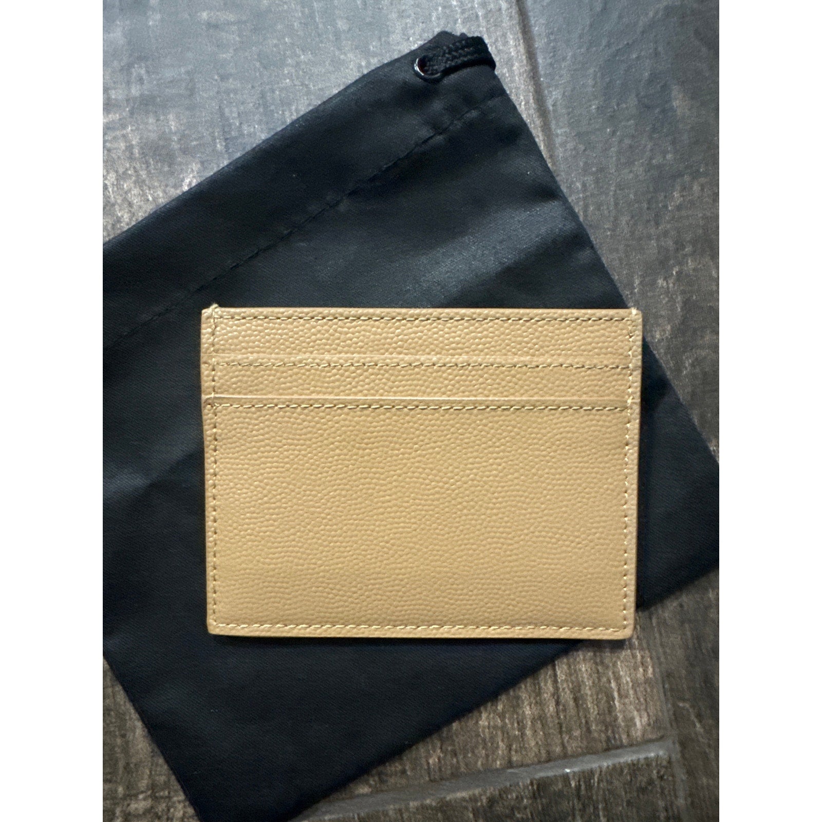 SAINT LAURENT
Logo-print leather card holder