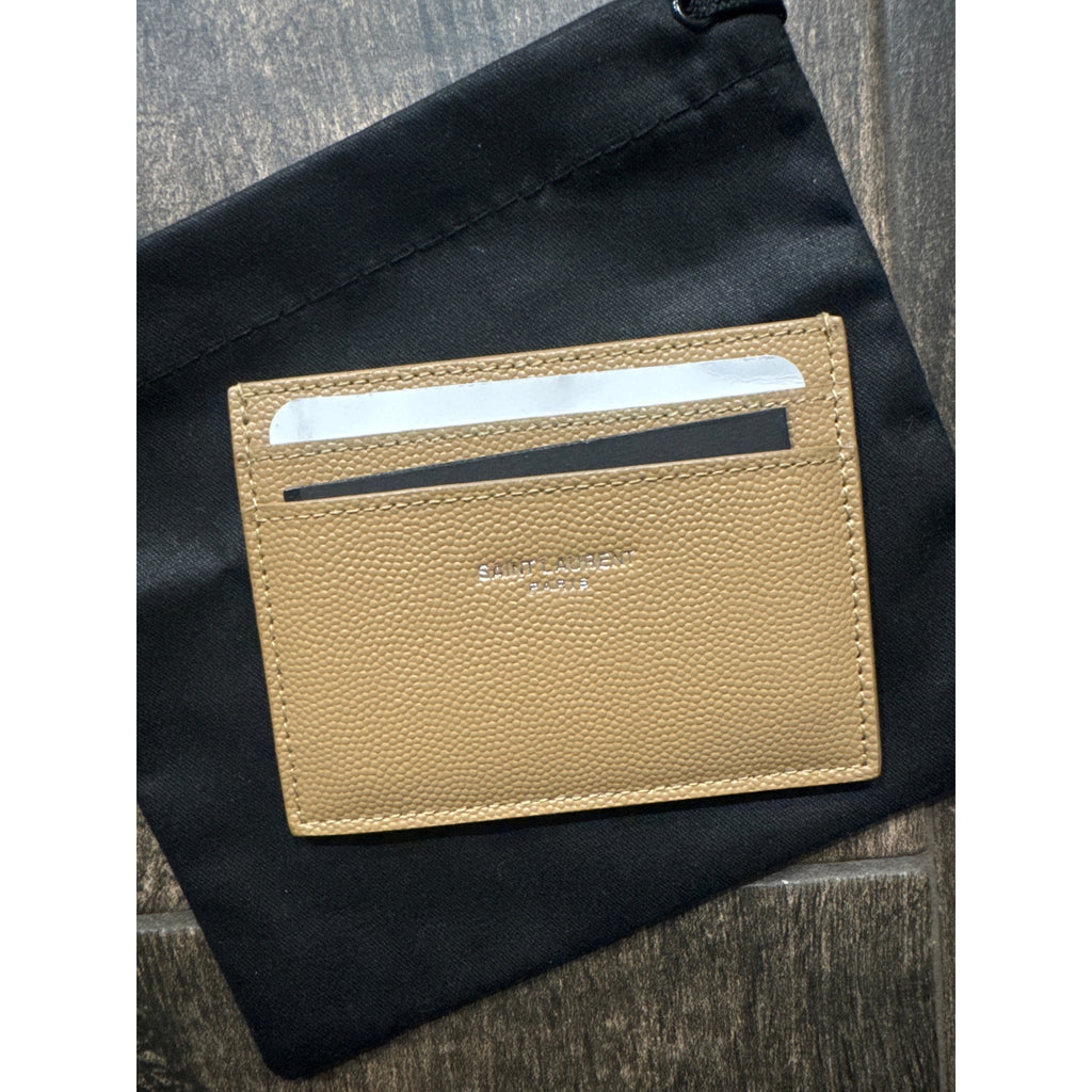 SAINT LAURENT
Logo-print leather card holder