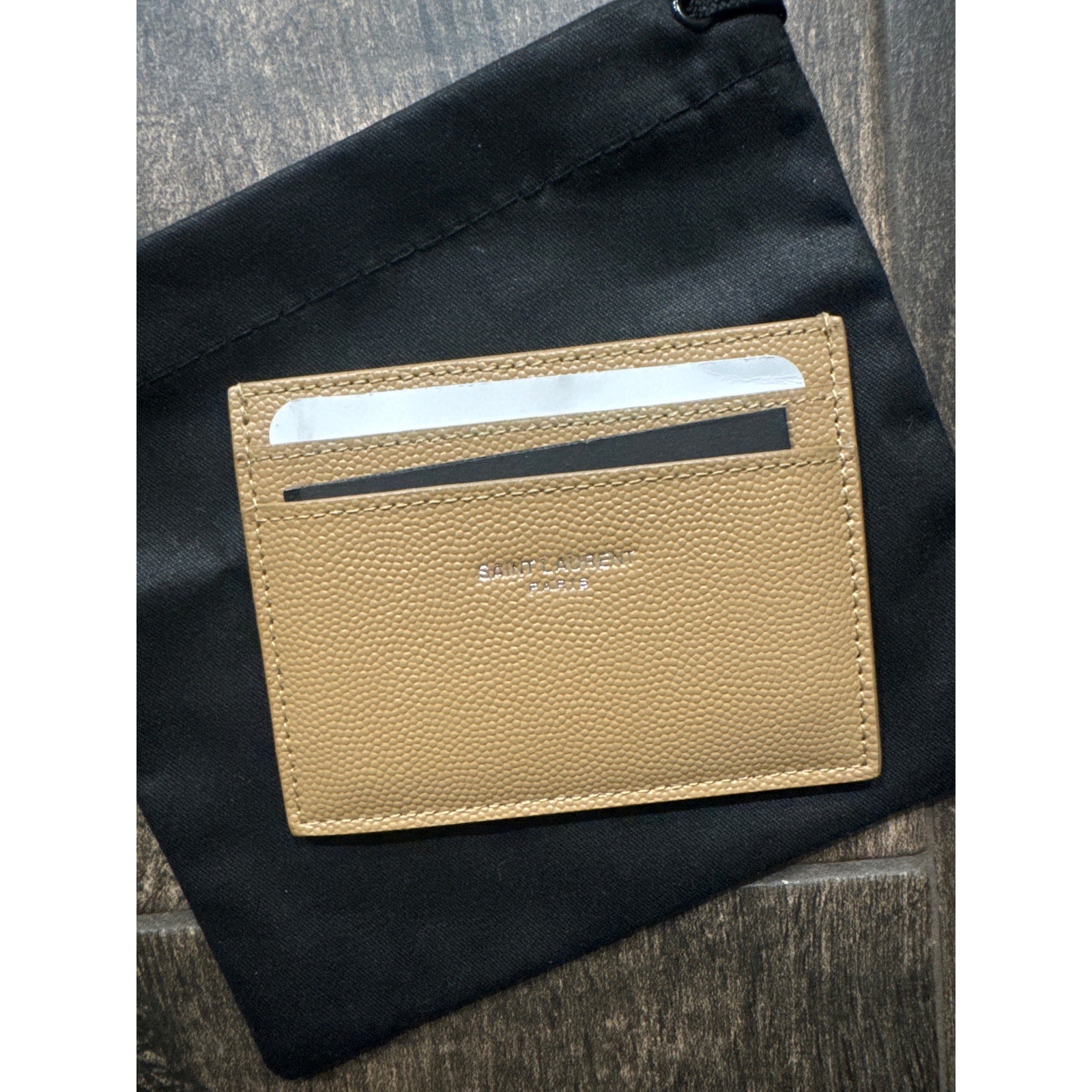 SAINT LAURENT
Logo-print leather card holder