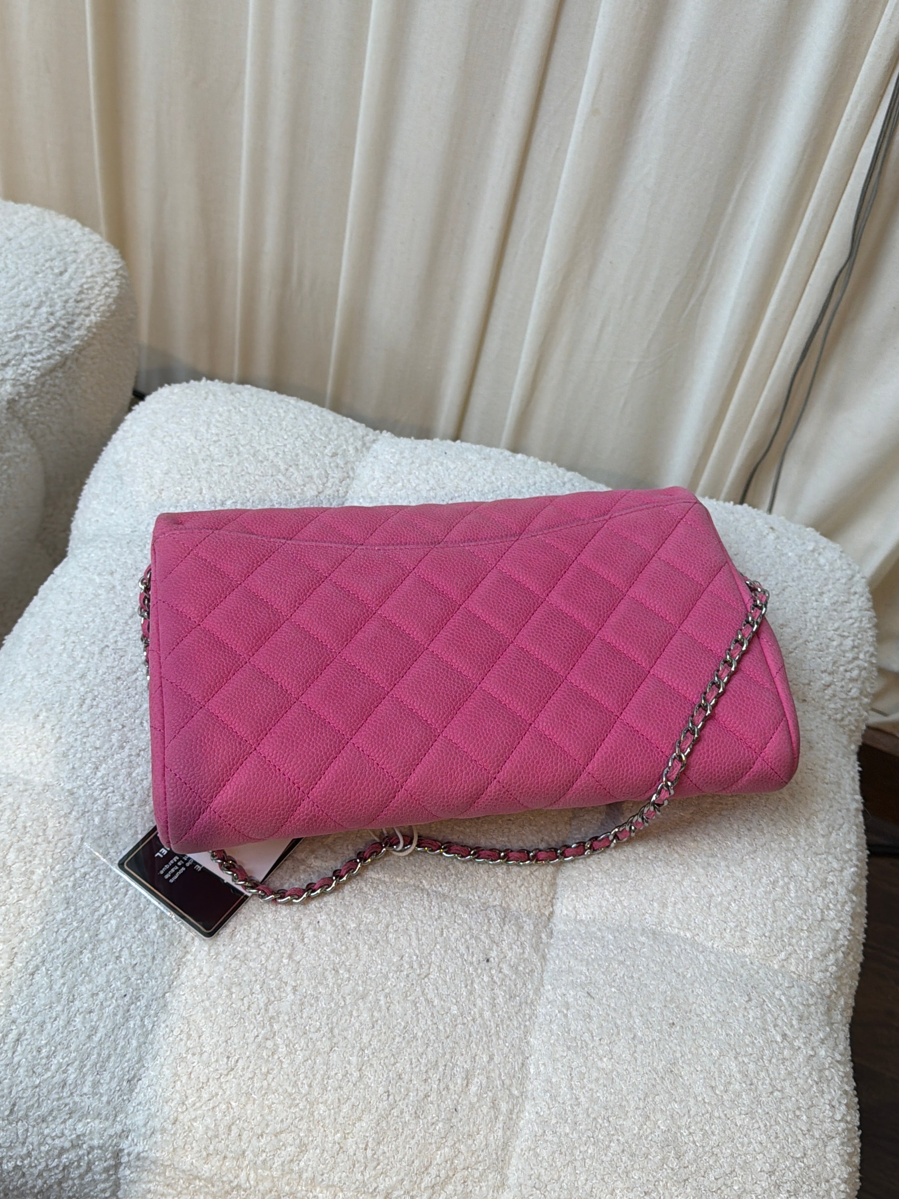 Chanel Pink caviar clutch on a chain