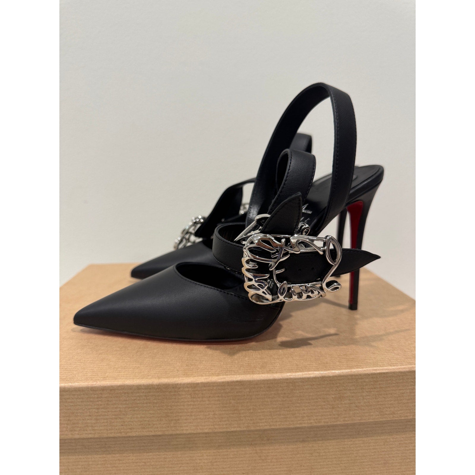 CHRISTIAN LOUBOUTIN 37 Giddylina 100 buckle-embellished leather pumps$1,495