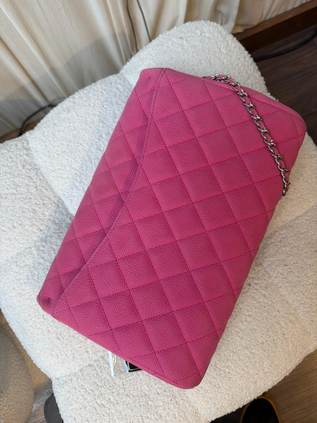 Chanel Pink caviar clutch on a chain