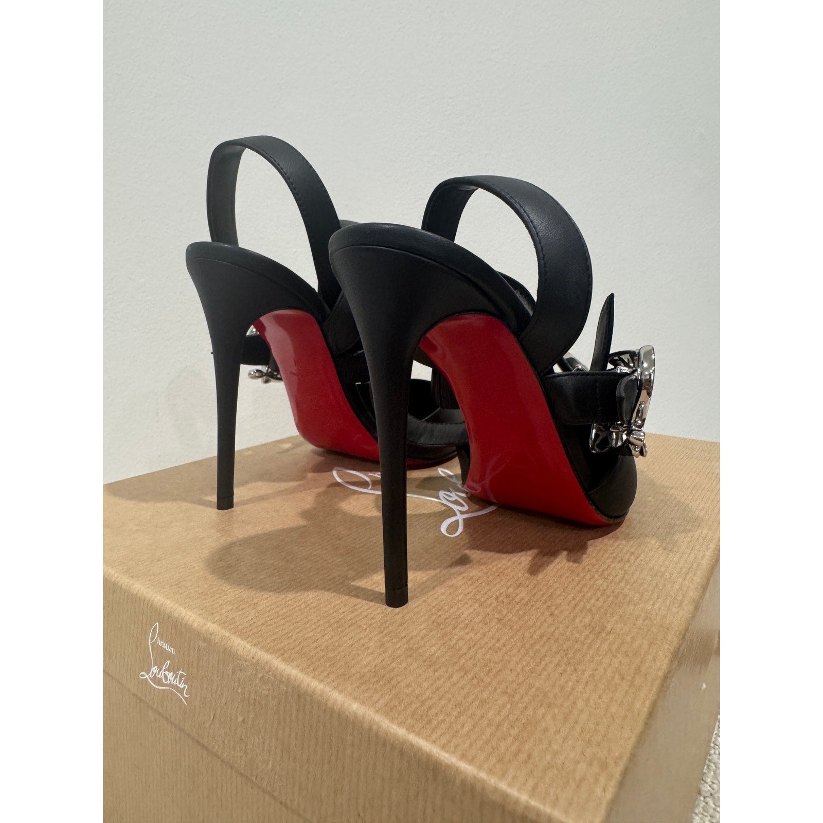 CHRISTIAN LOUBOUTIN 37 Giddylina 100 buckle-embellished leather pumps$1,495