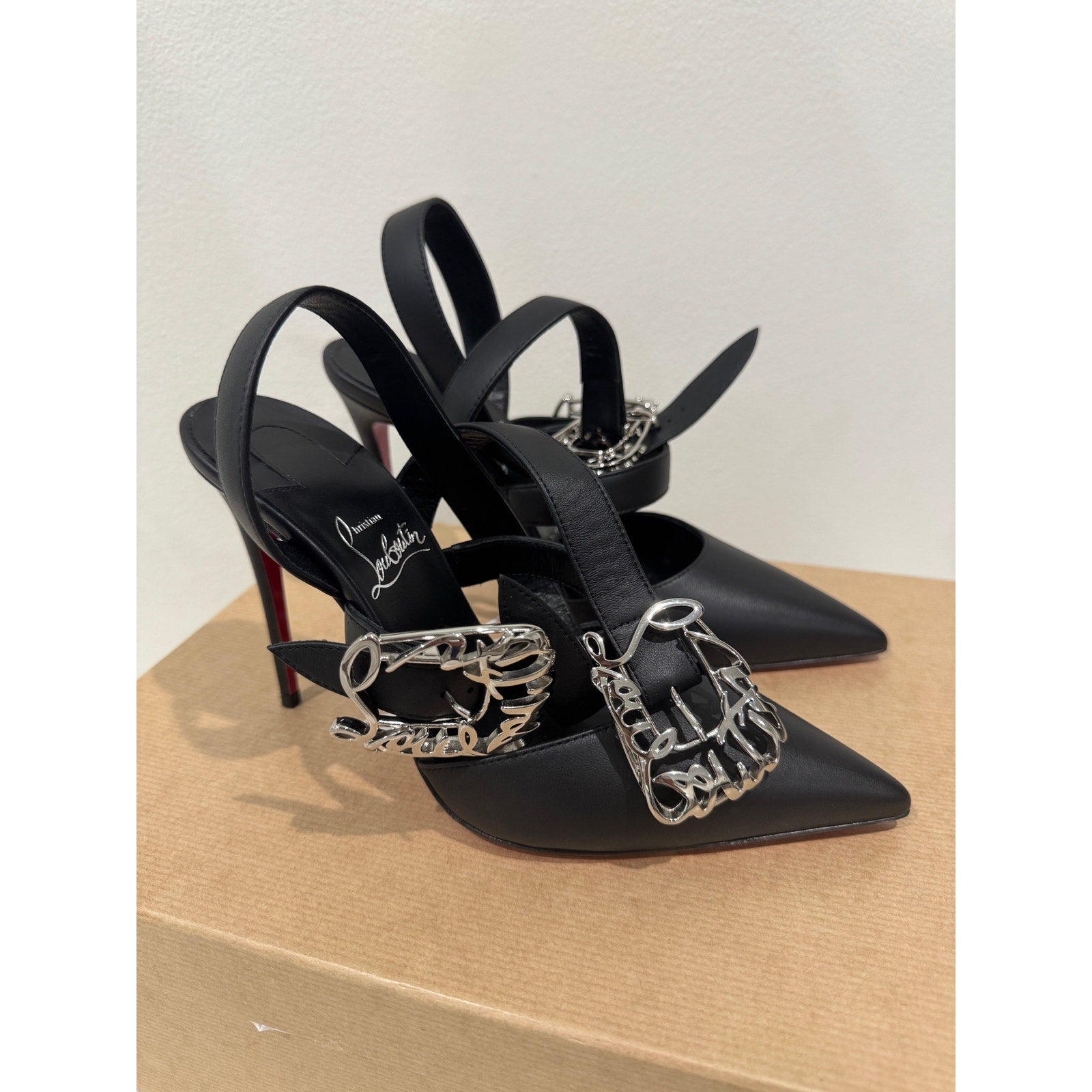 CHRISTIAN LOUBOUTIN 37 Giddylina 100 buckle-embellished leather pumps$1,495